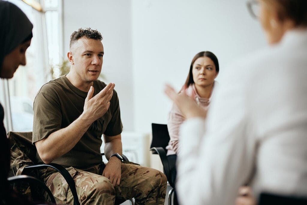Veteran talks in group therapy while in outpatient eating disorder treatment